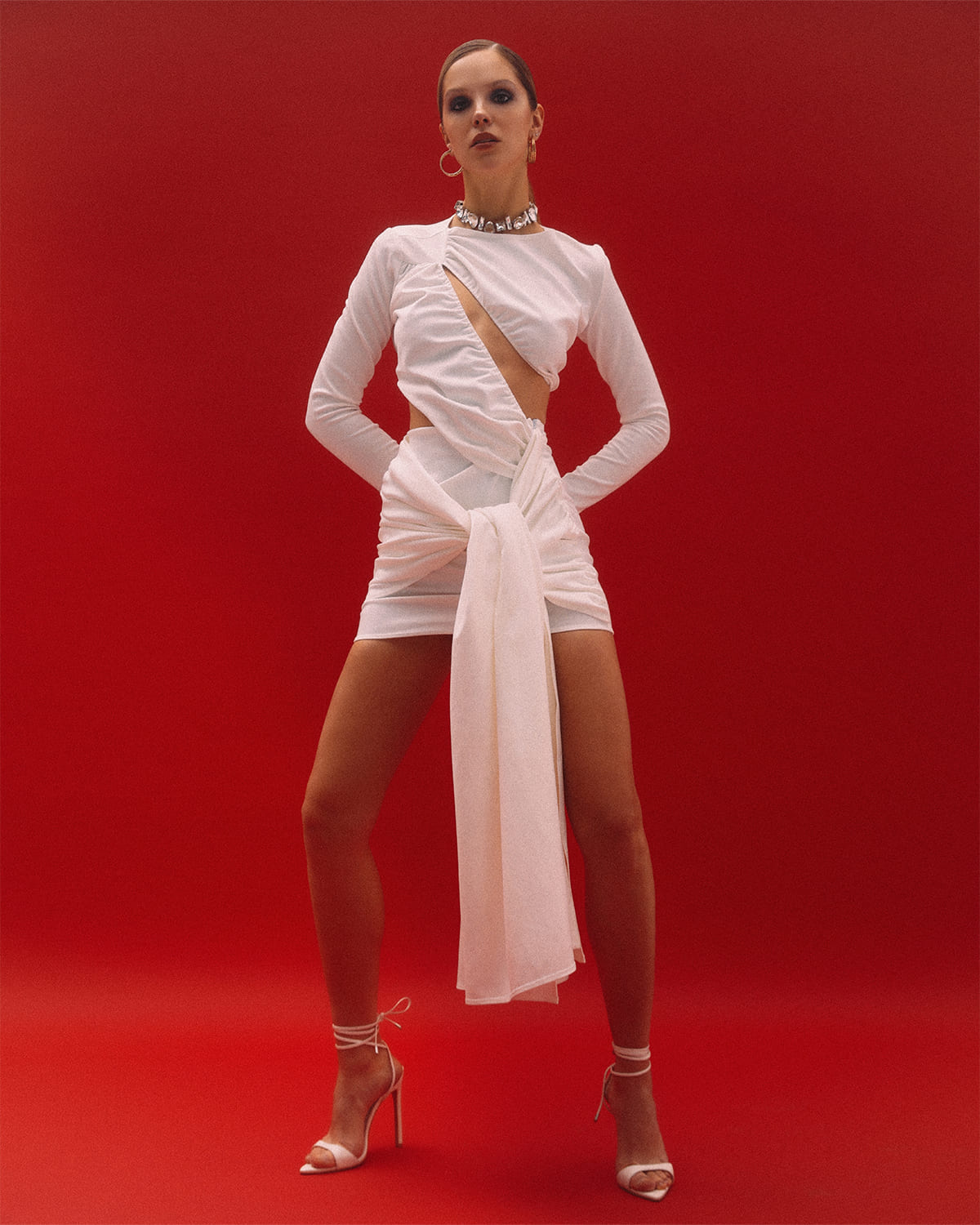 A white dress with a figure-hugging neckline