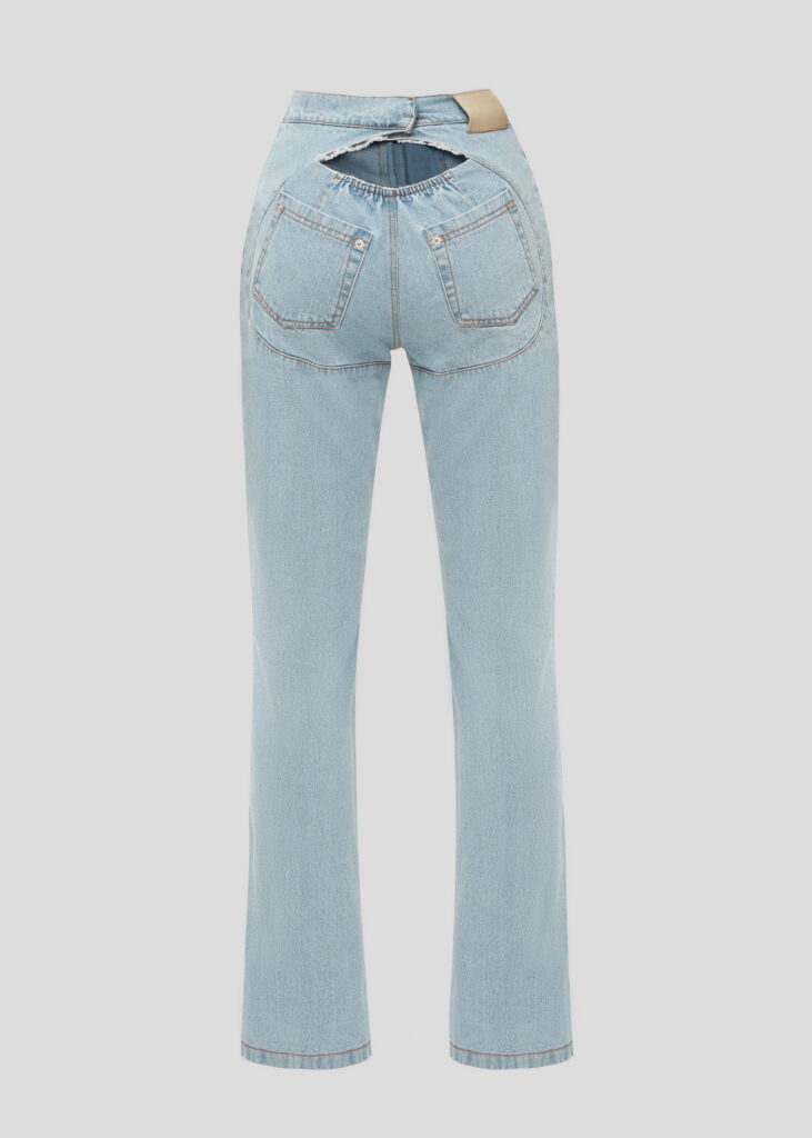 Blue jeans with a cut on the buttocks