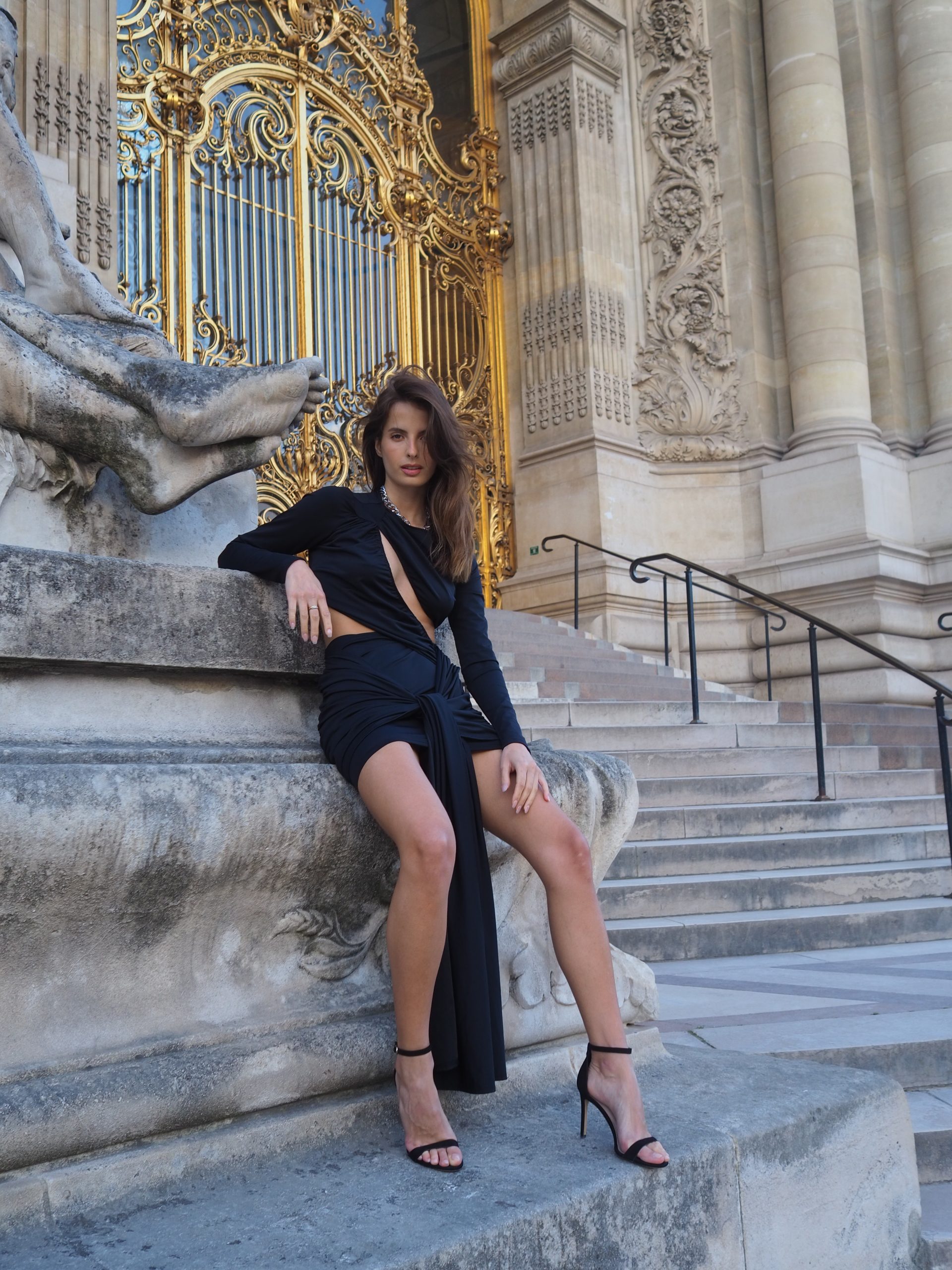 A black dress with a figure-hugging neckline