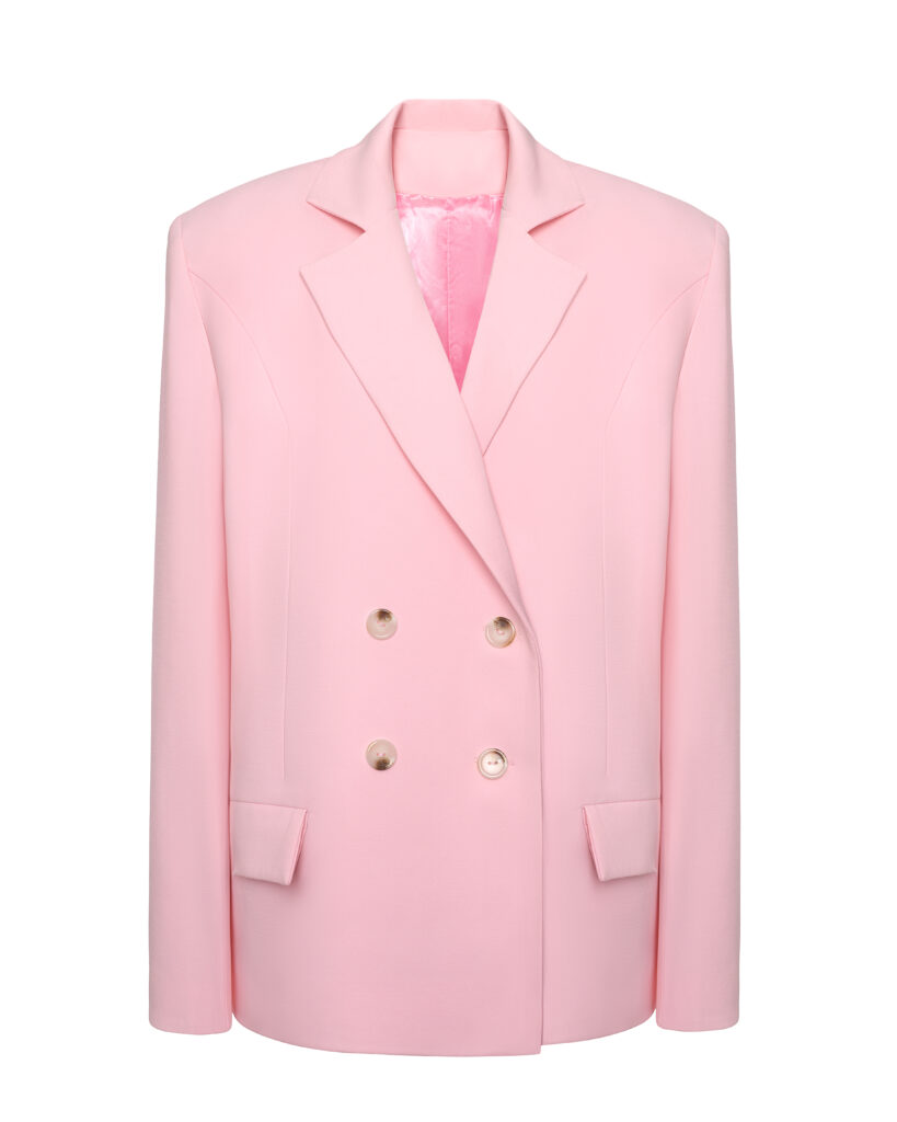 A classic suit with an oversized pink jacket