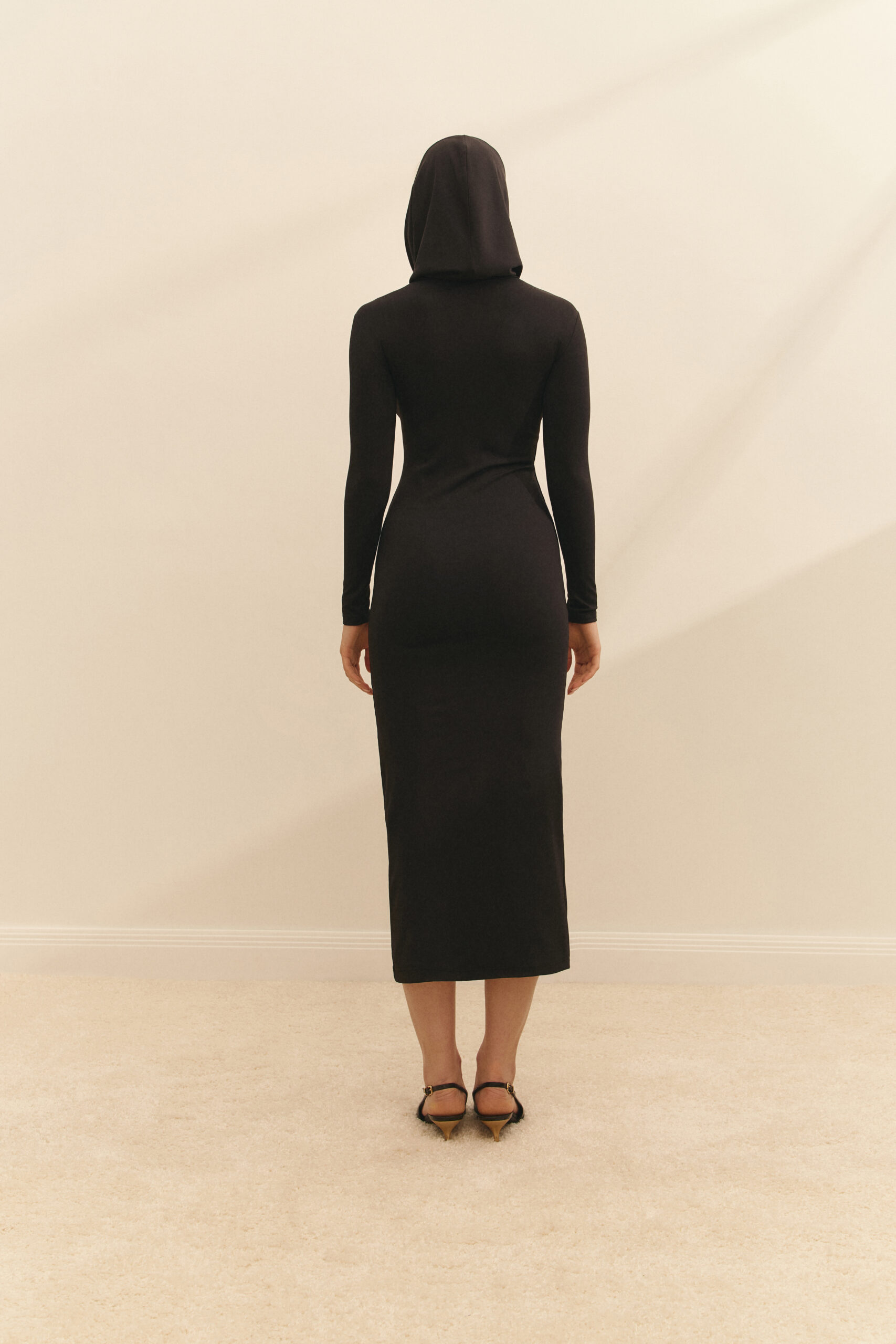The dress with a hood is black