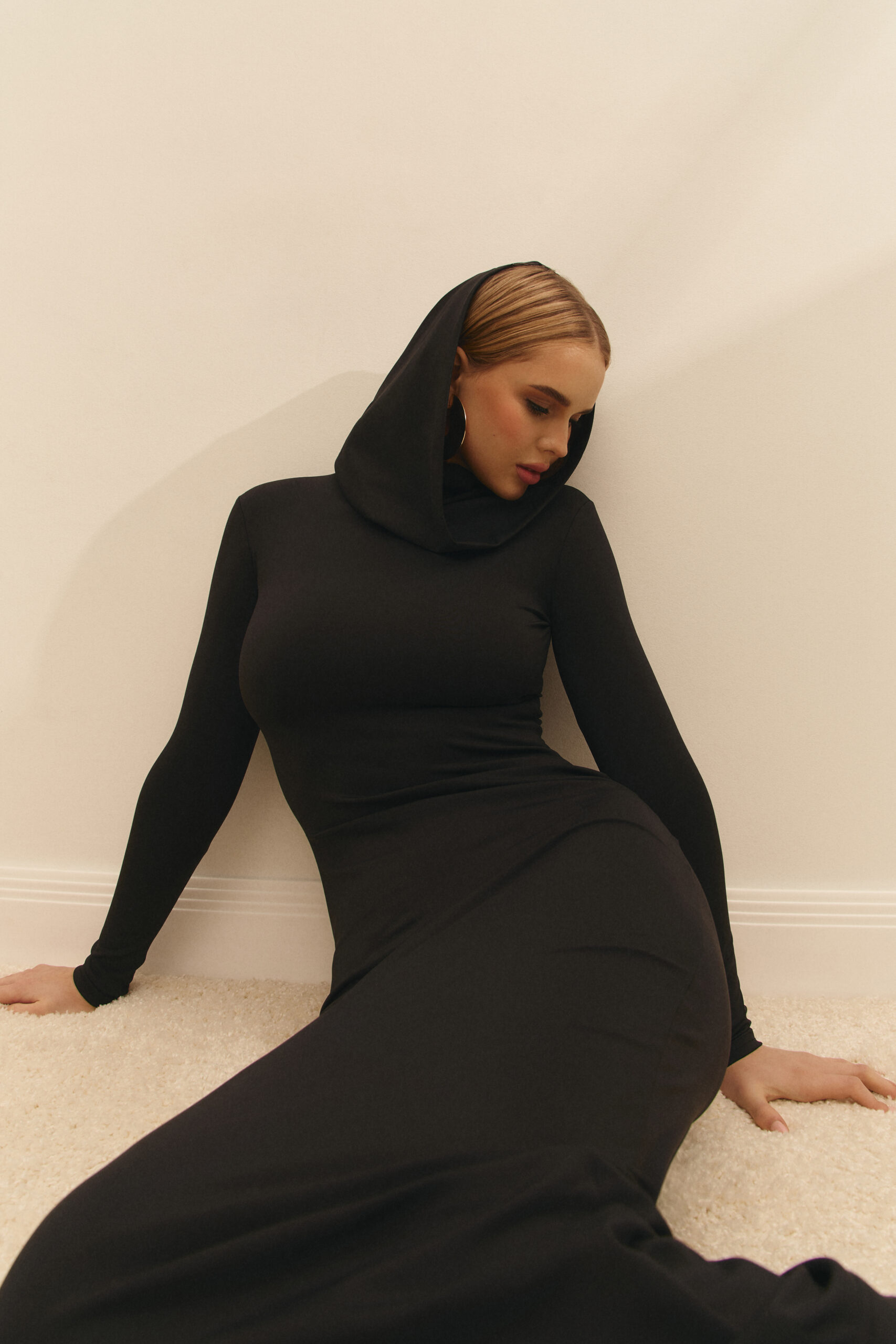 The dress with a hood is black