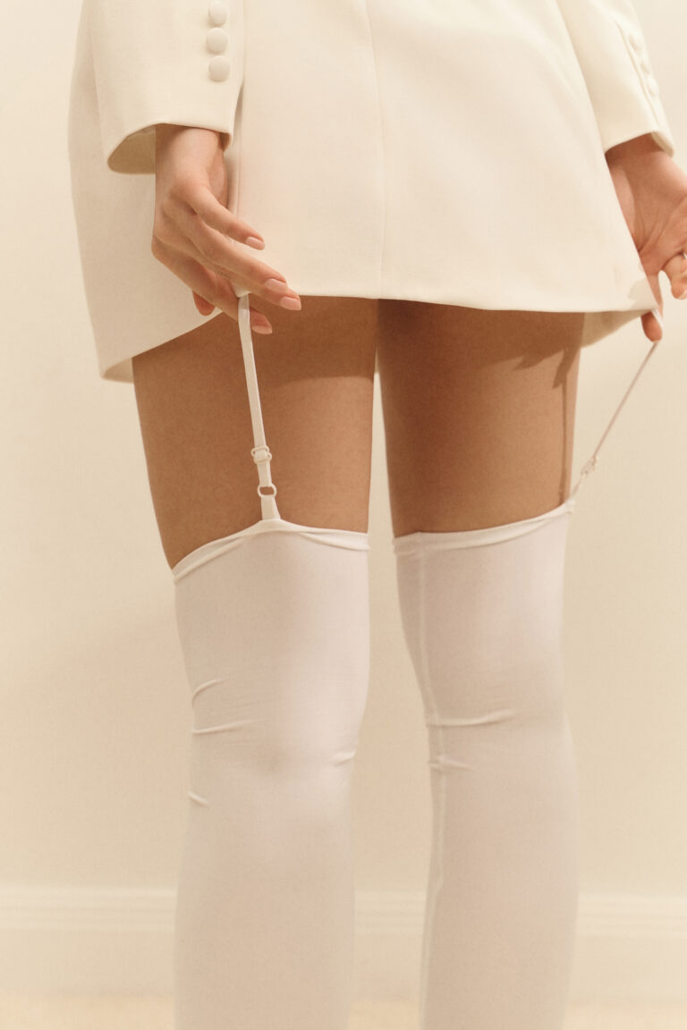 Dress-jacket fitted with white stockings