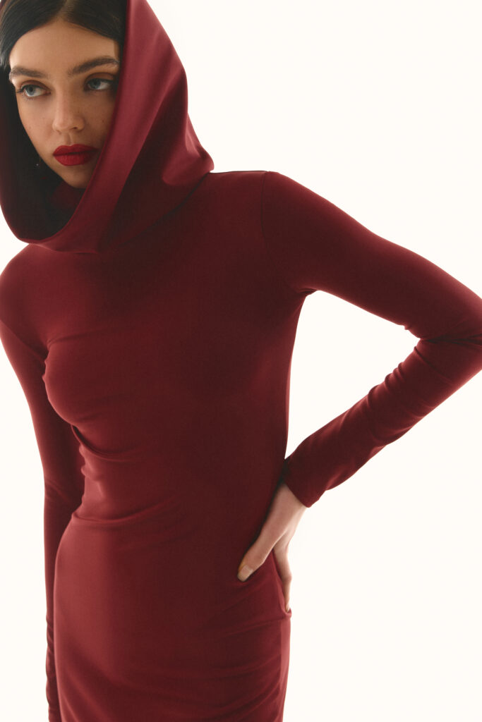 The dress with a hood is burgundy
