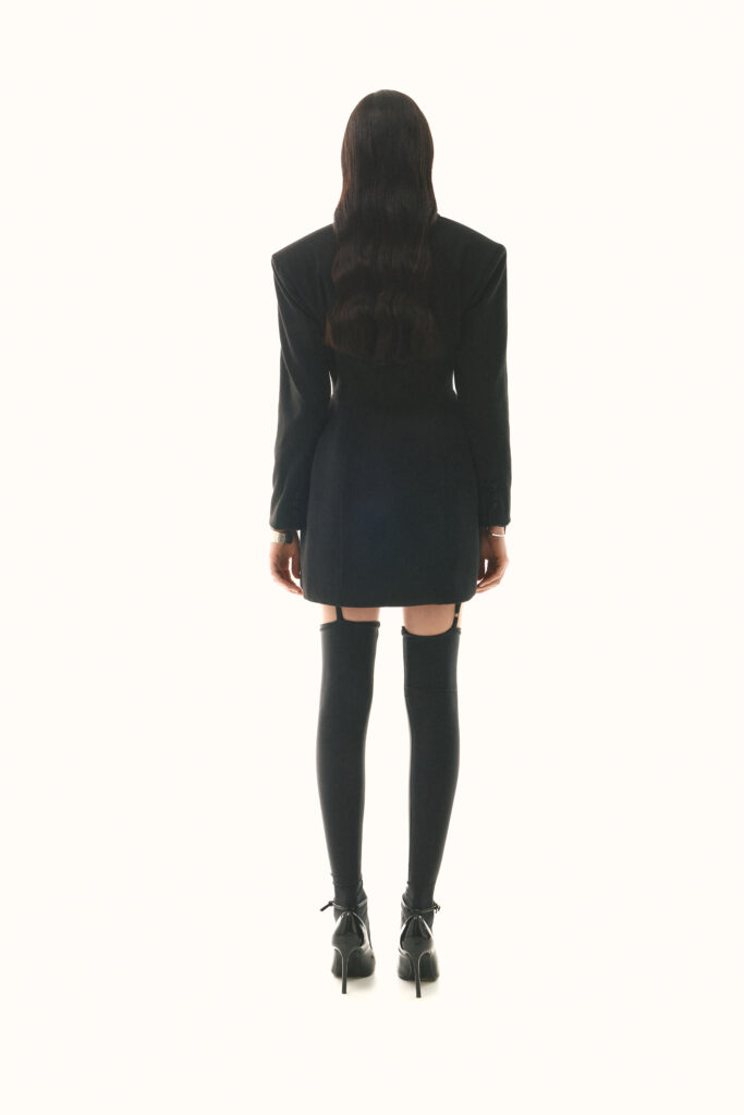 Dress-jacket fitted with black stockings