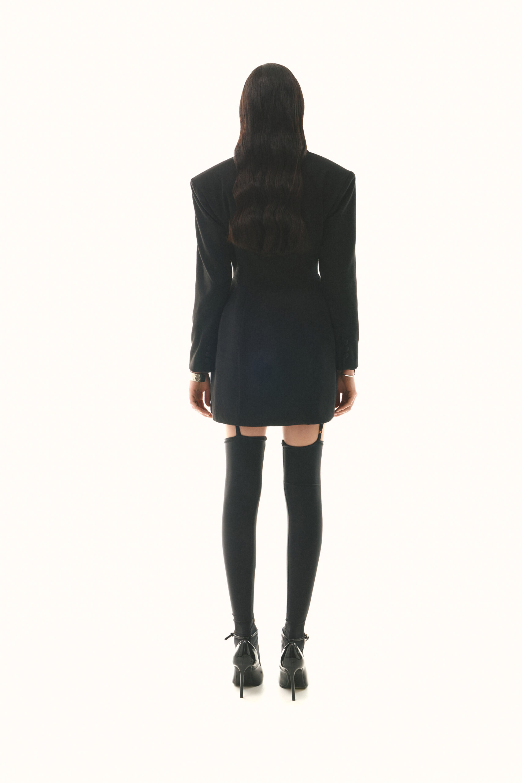 Dress-jacket fitted with black stockings