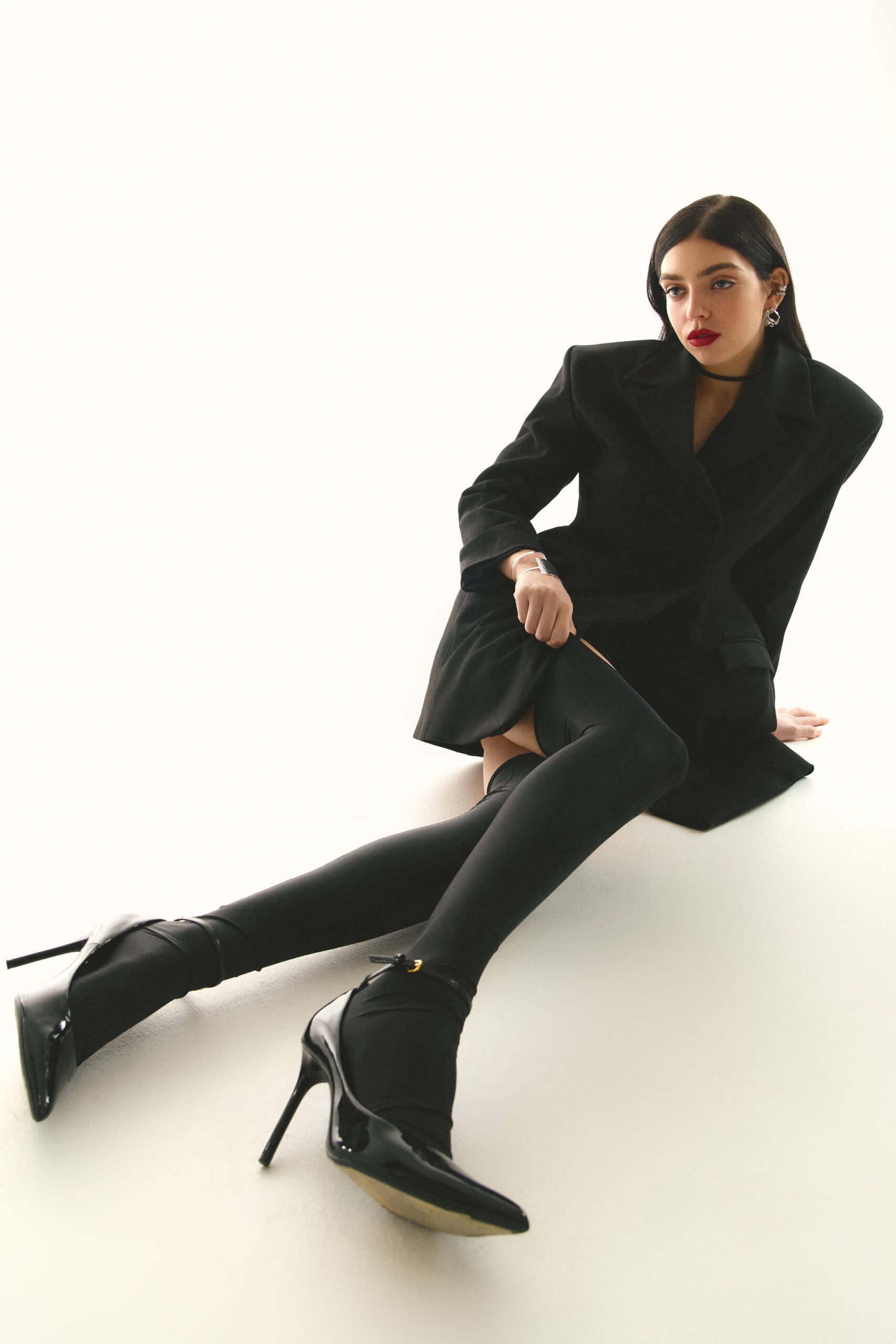Dress-jacket fitted with black stockings