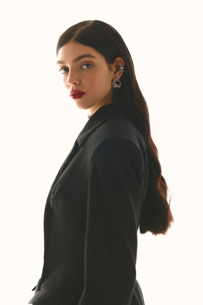 Dress-jacket fitted with black stockings