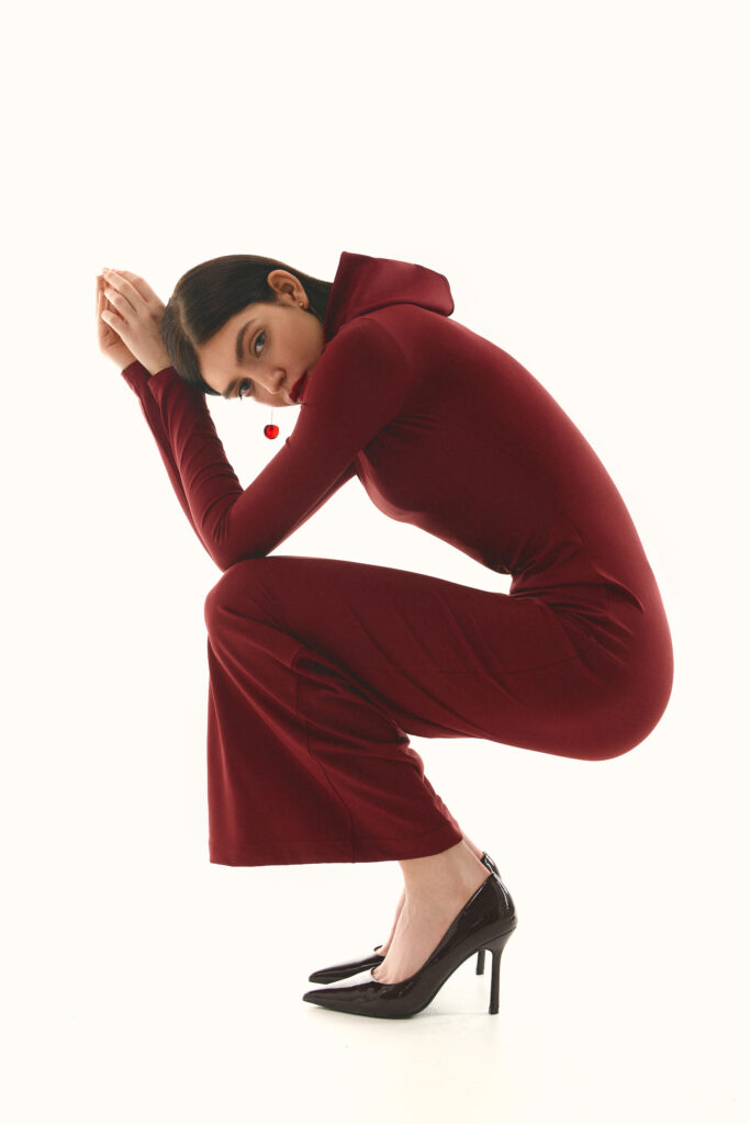 The dress with a hood is burgundy