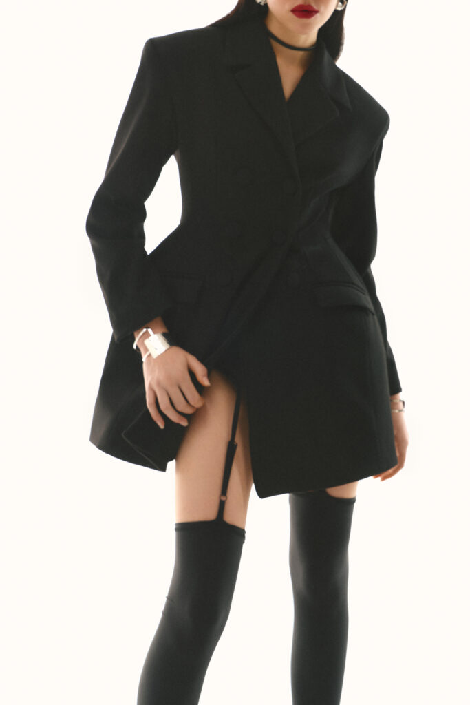 Dress-jacket fitted with black stockings