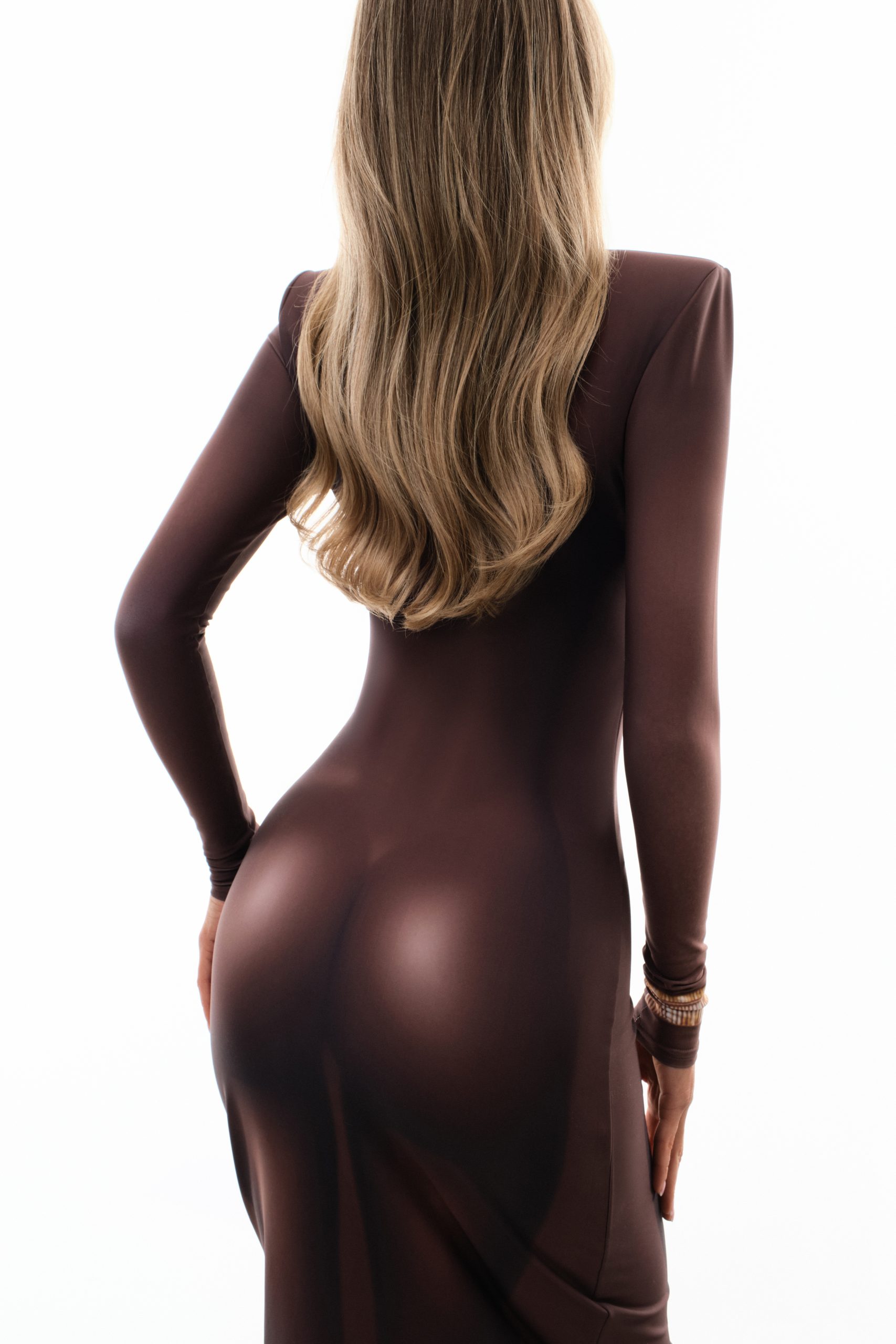 Dress with female body contours and accent bracelets
