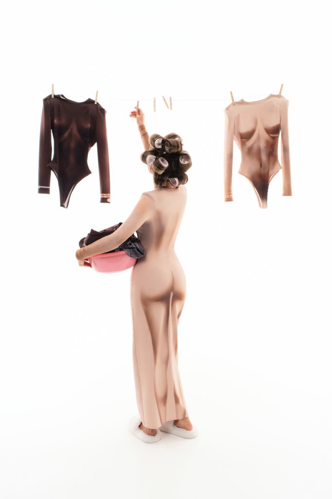 Dress with female body contours and accent bracelets