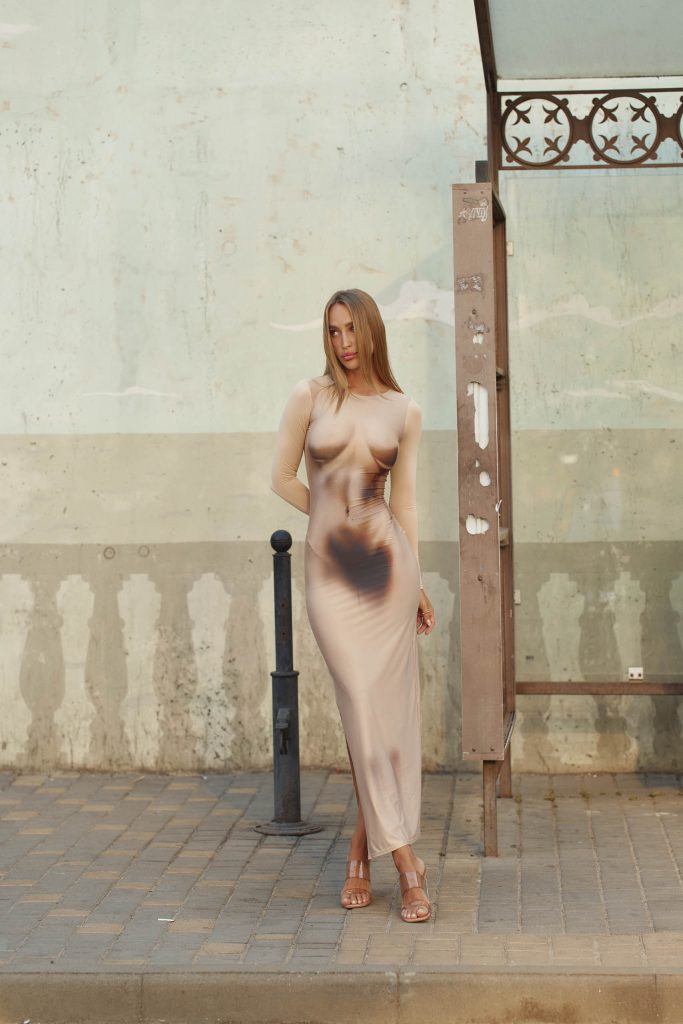 Beige midi dress with a female body print